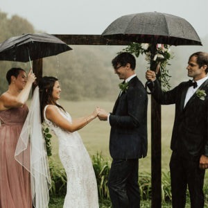 Couple gets married in the rain at the barns at hamilton station