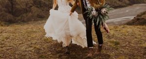 detail of wedding couple running