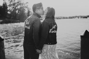 black and white portrait of couple kissing