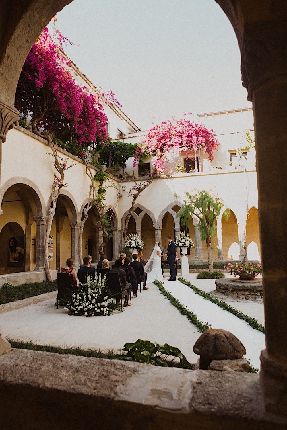 floral lined courtyard wedding ceremony in sorrento italy