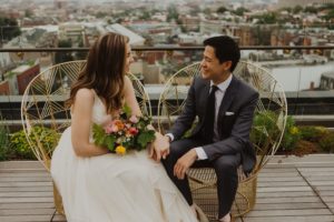 couple to be married sit on adams morgan rooftop in dc