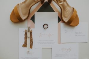 detail image of wedding stationary and jewerly