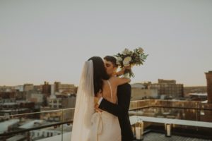 couple kisses before they elope