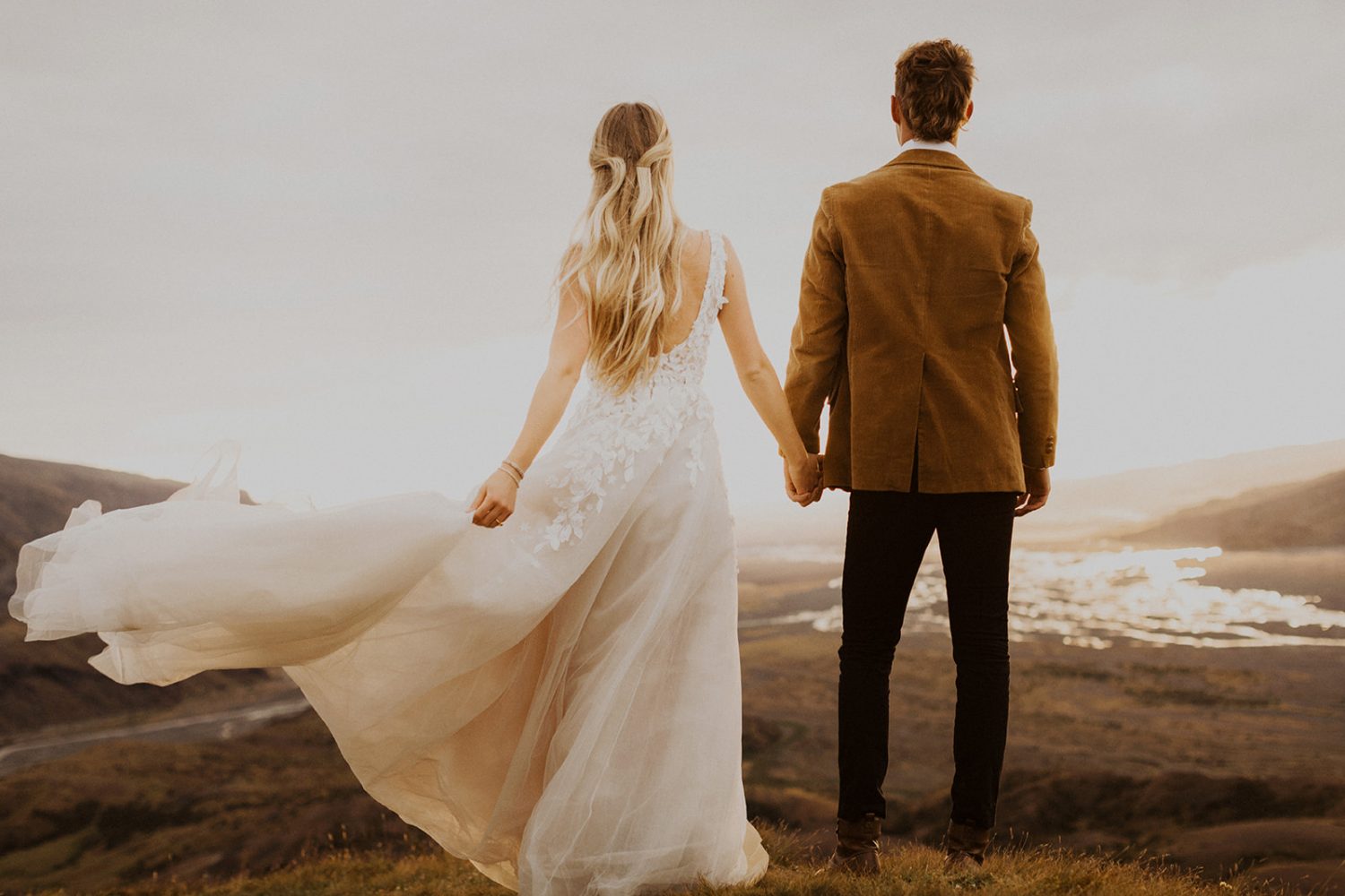 Couple holds hands at their Iceland elopement