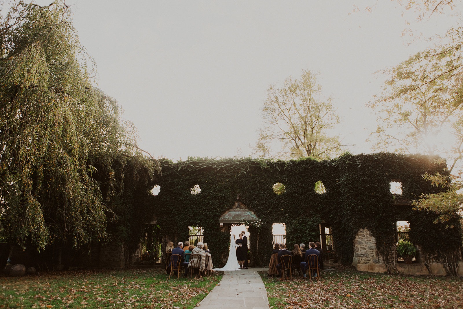Couples marries at ivy wall at Goodstone Inn