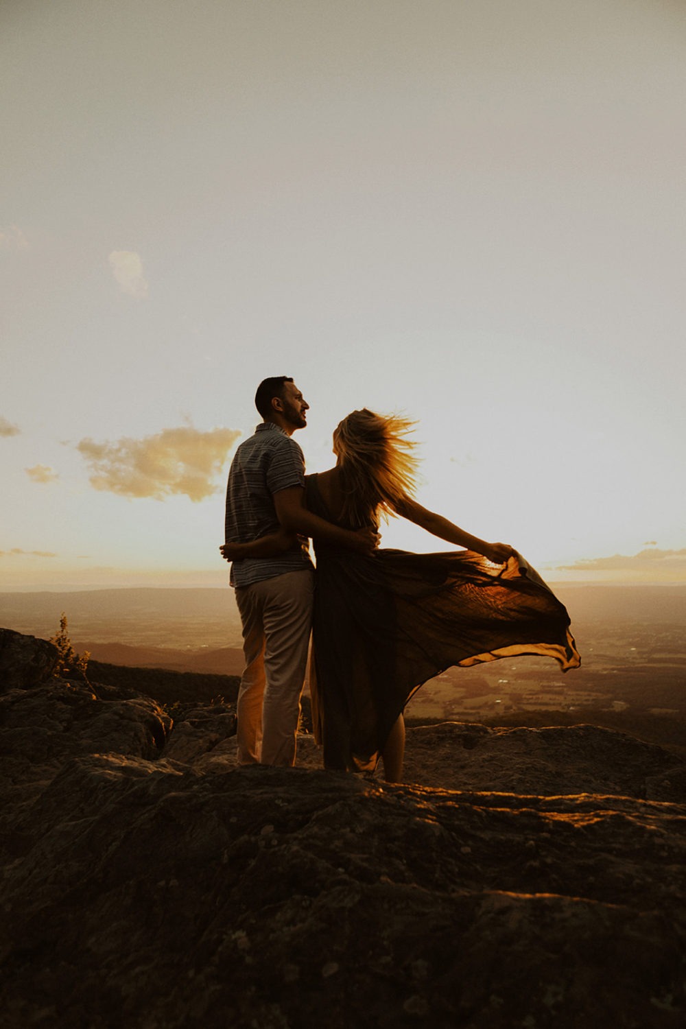 Couple embraces at sunset Shenandoah National Park adventure session
