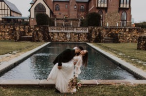 Couple kisses at Dover Hall estate wedding venue