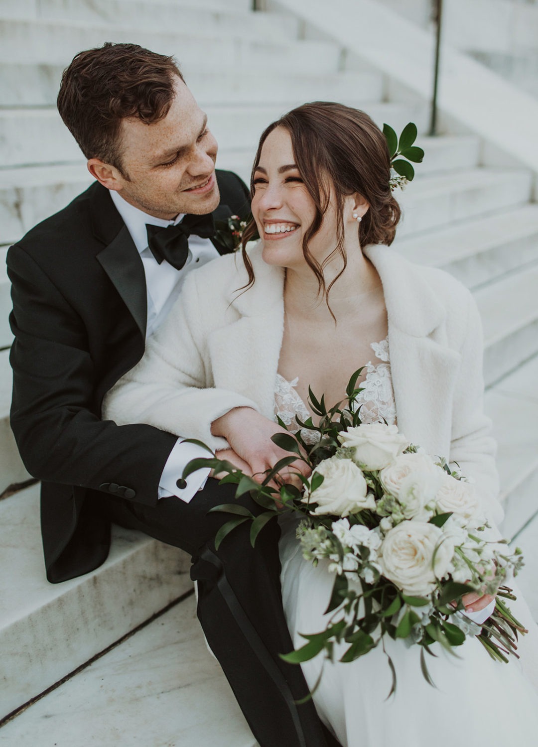 Couple sits on steps of Lincoln Memorial at Washington, DC elopement