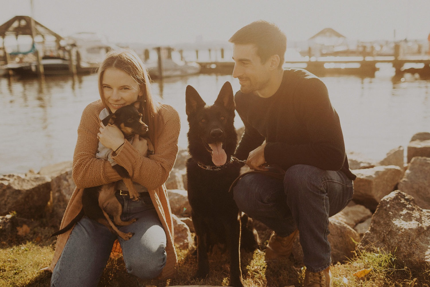 Couple holds dogs at engagement session