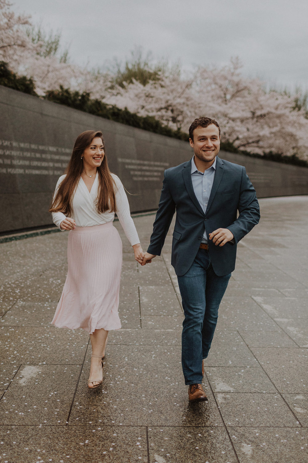 Couples walk holding hands at Washington DC engagement session