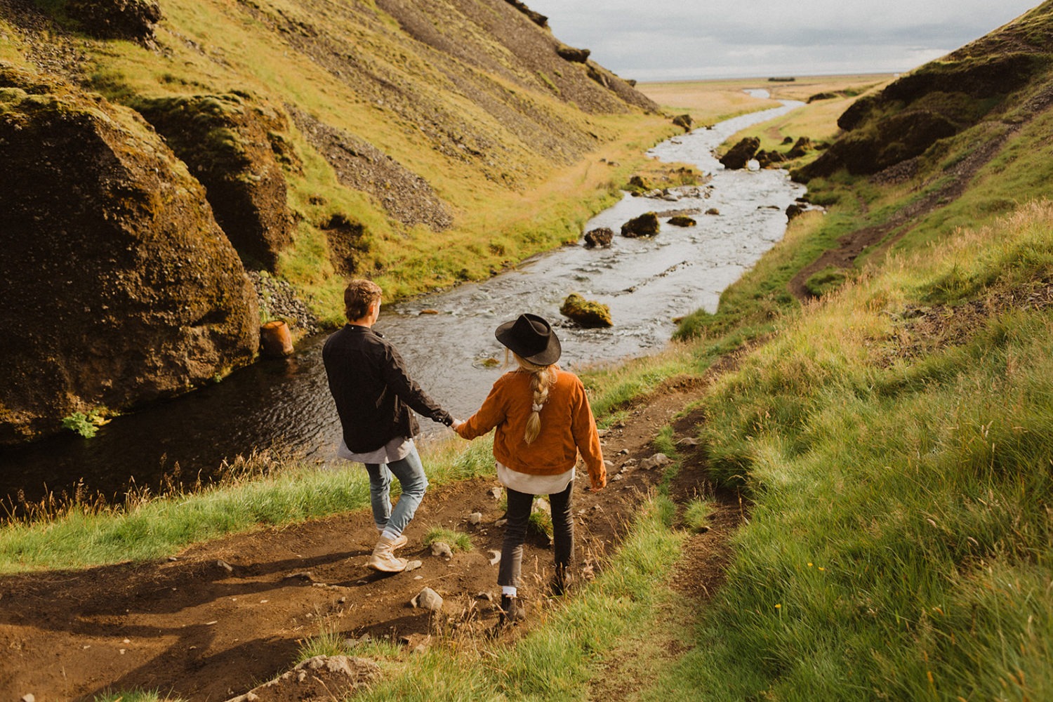 Couples walk holding hands at Iceland engagement session