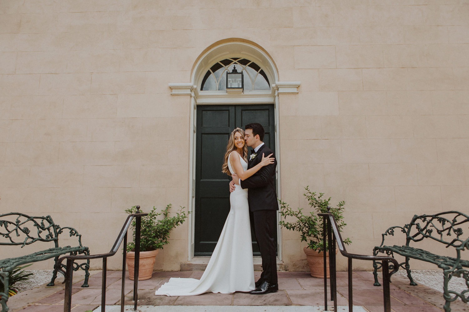 Couple kisses at Georgetown Tudor Place wedding