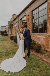 Couple kisses at industrial Baltimore wedding venue