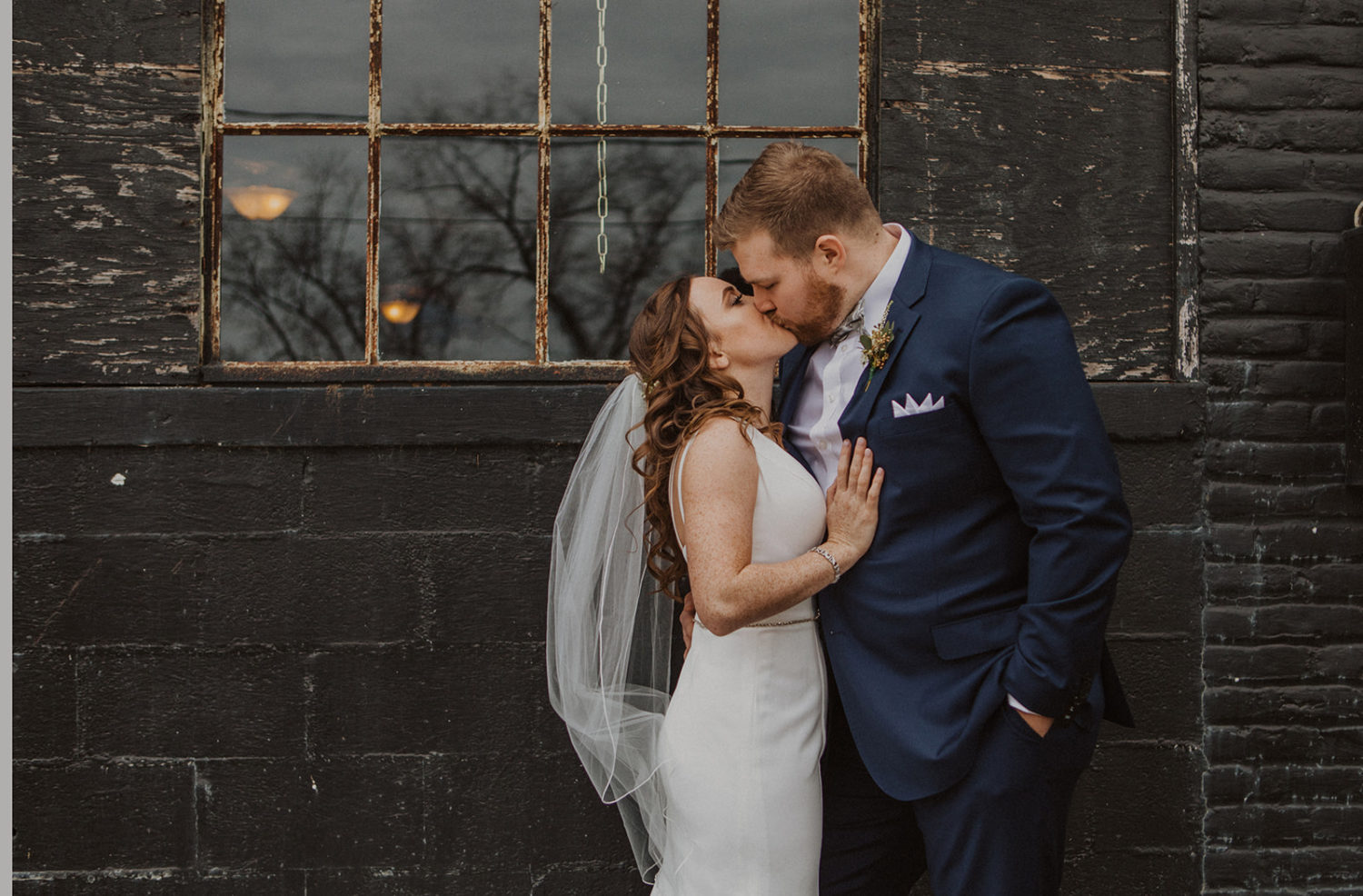 Couple kisses at Industrial Baltimore Wedding Venue