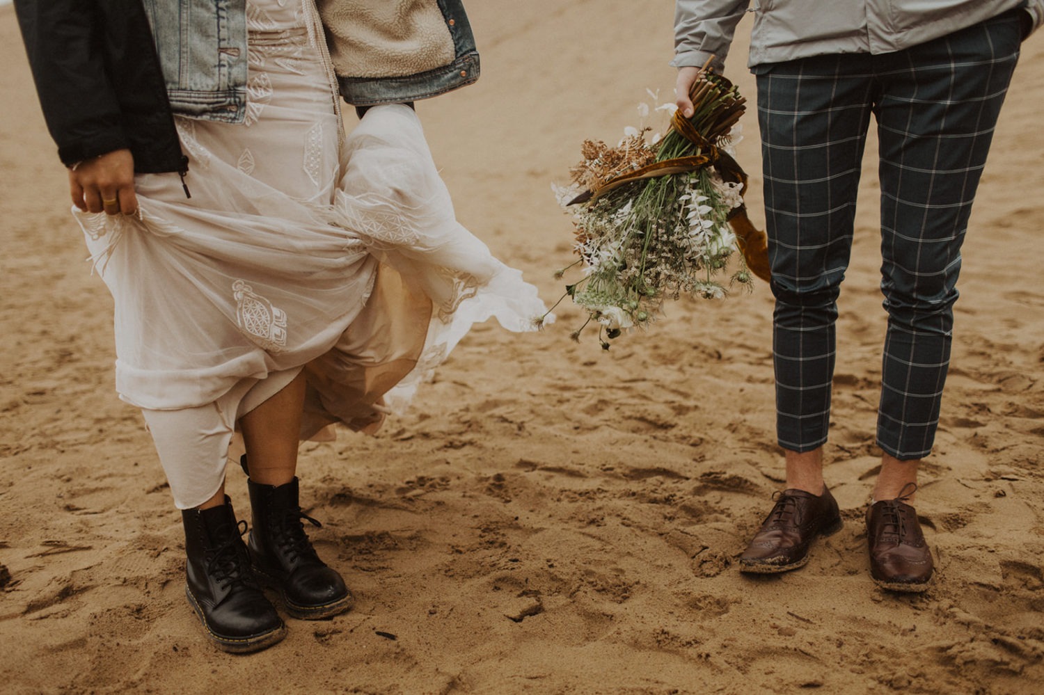 Couple shows off shoes at Oregon coast elopement