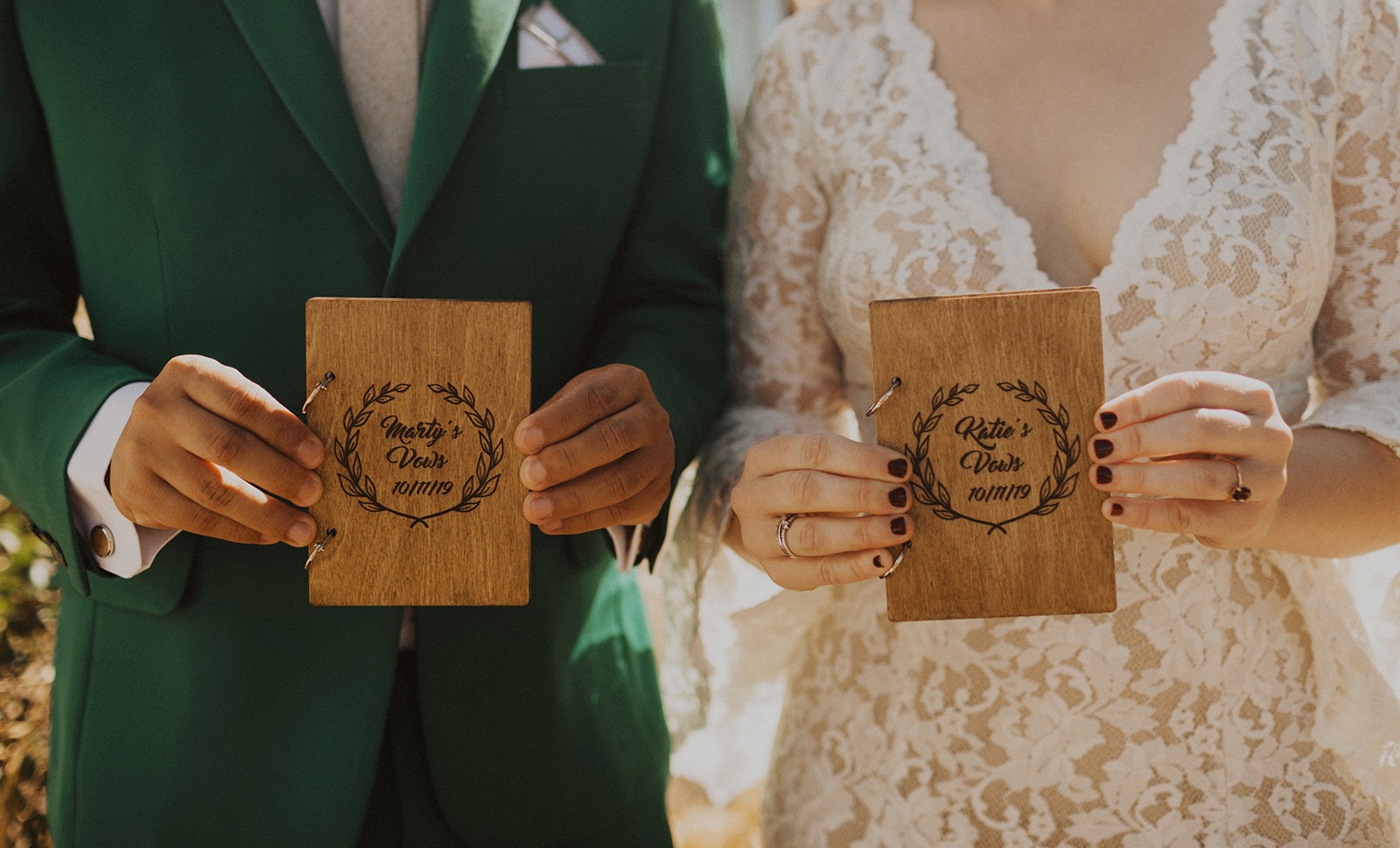 Couple holds personalized wedding vow books