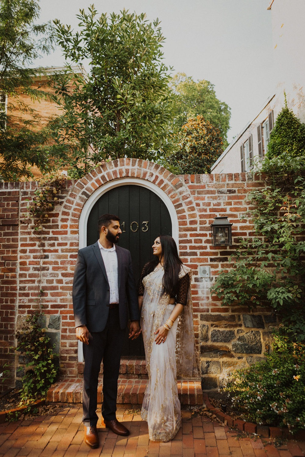 Couple holds hands at Georgetown engagement session
