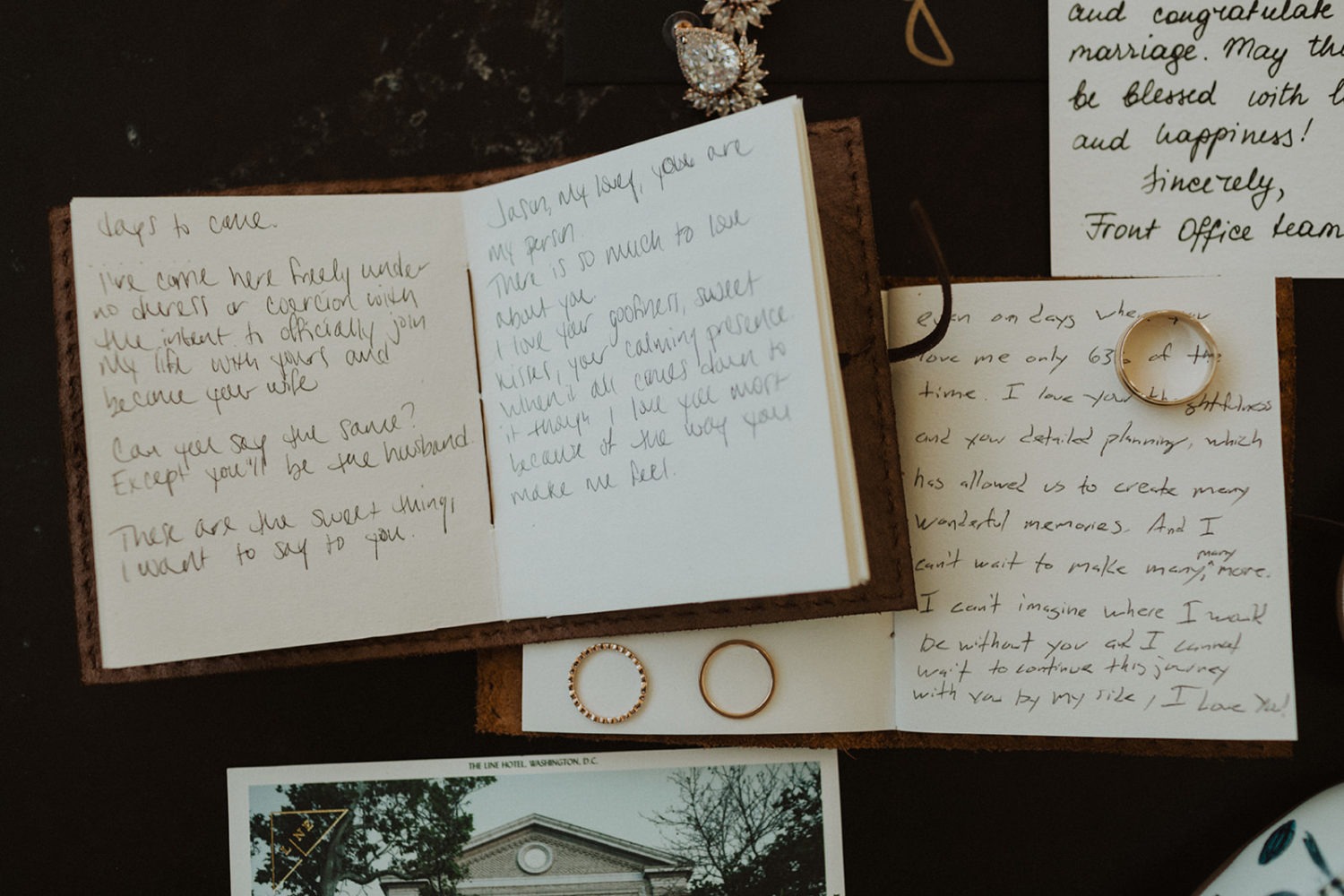 Rings and vow books at full-day elopement