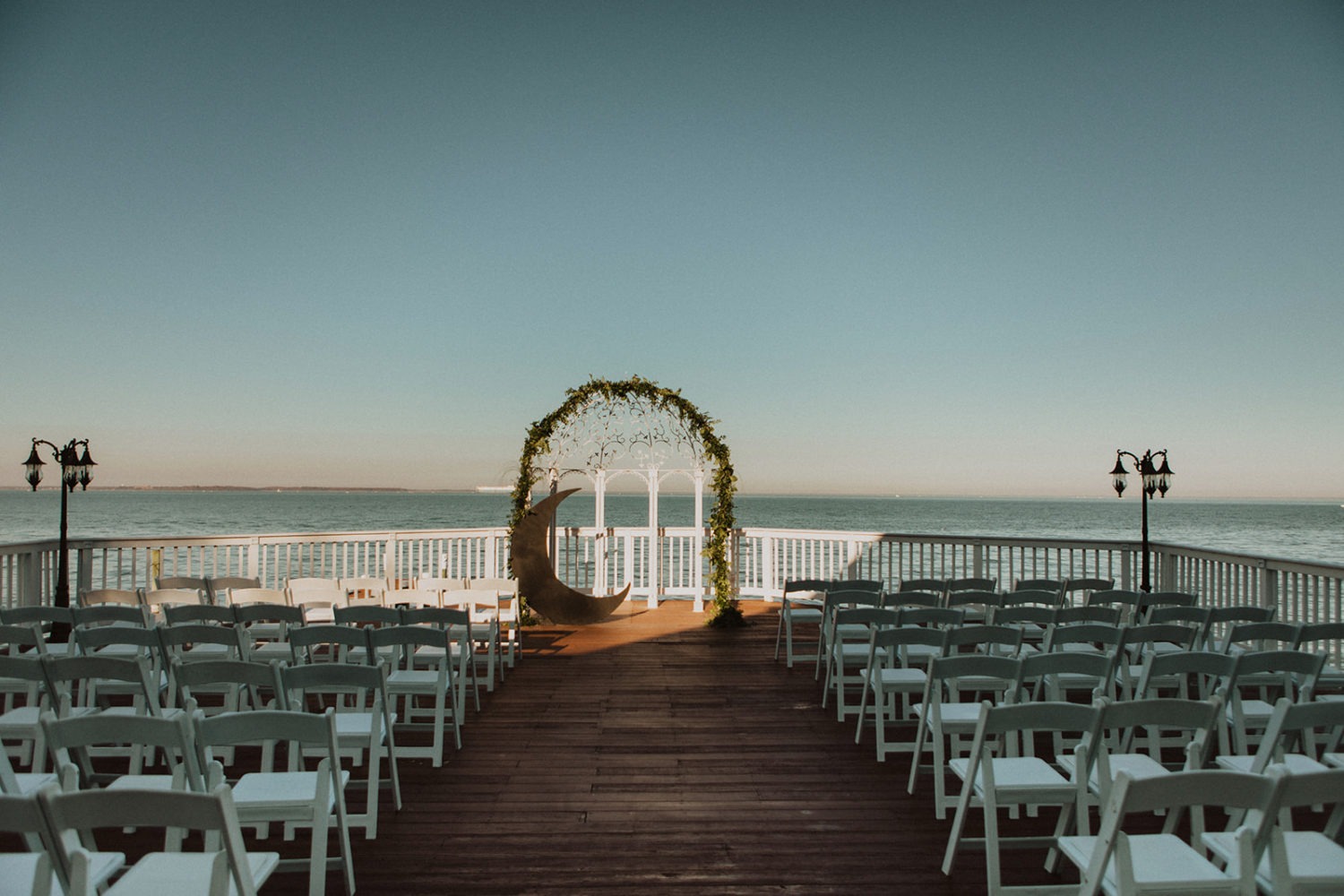 Ceremony set up on deck at Celebrations At the Bay waterfront wedding venue