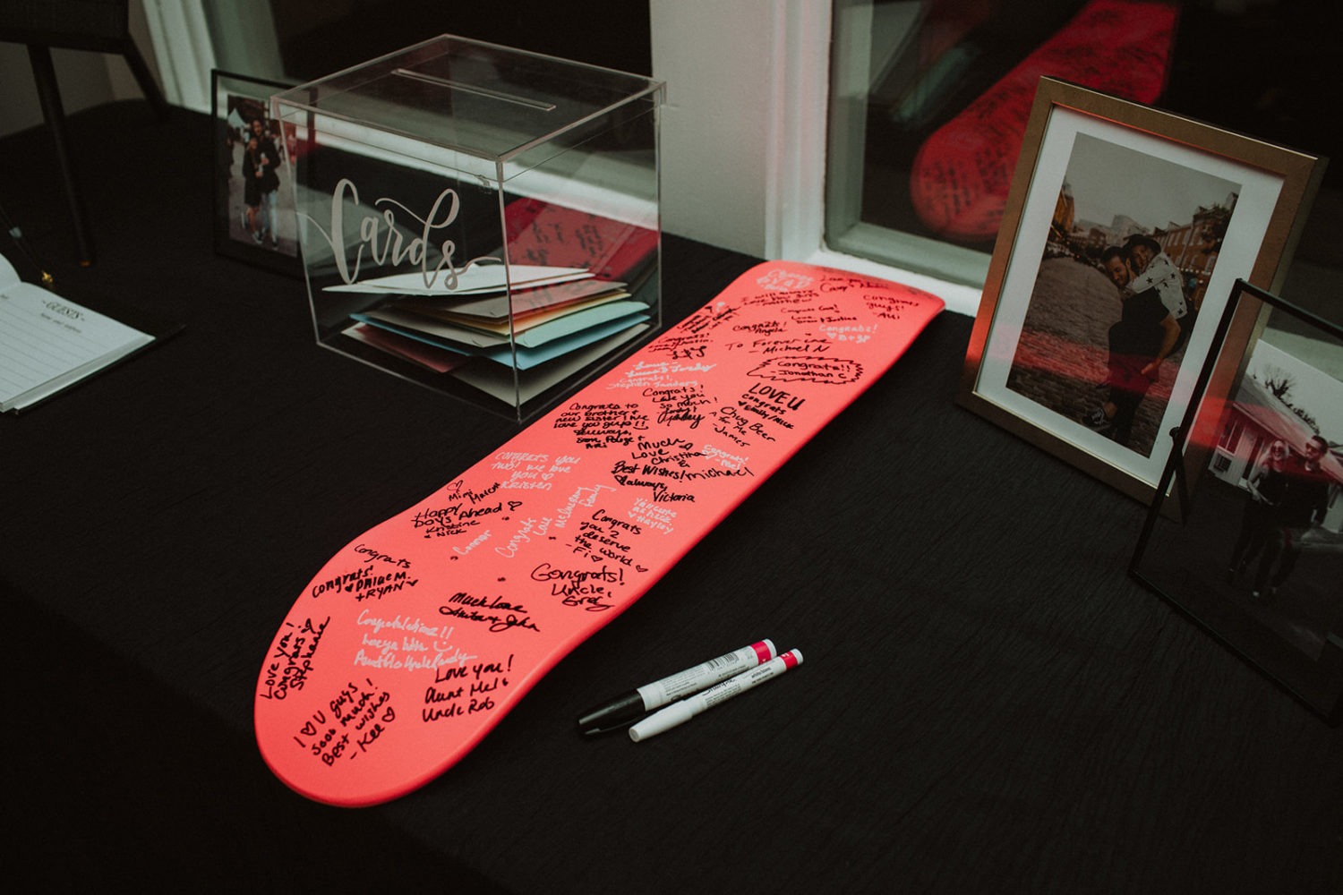 Bottom of skateboard used as guest book at Celebrations At the Bay wedding venue