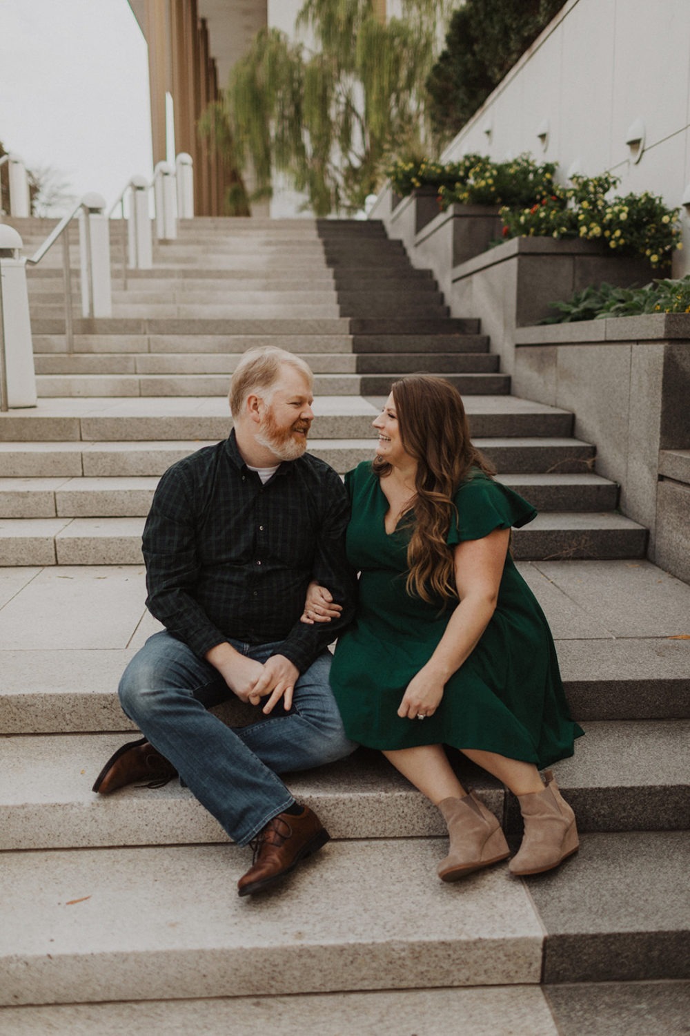 Couples sits on steps at Washington DC engagement session