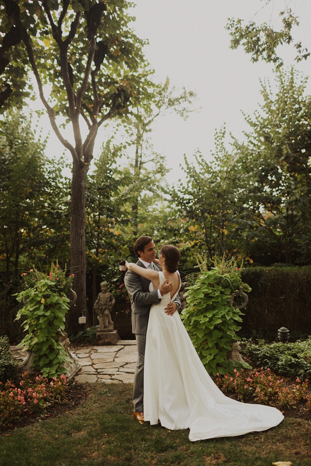 Couple embraces in garden of Meridian House DC wedding venue