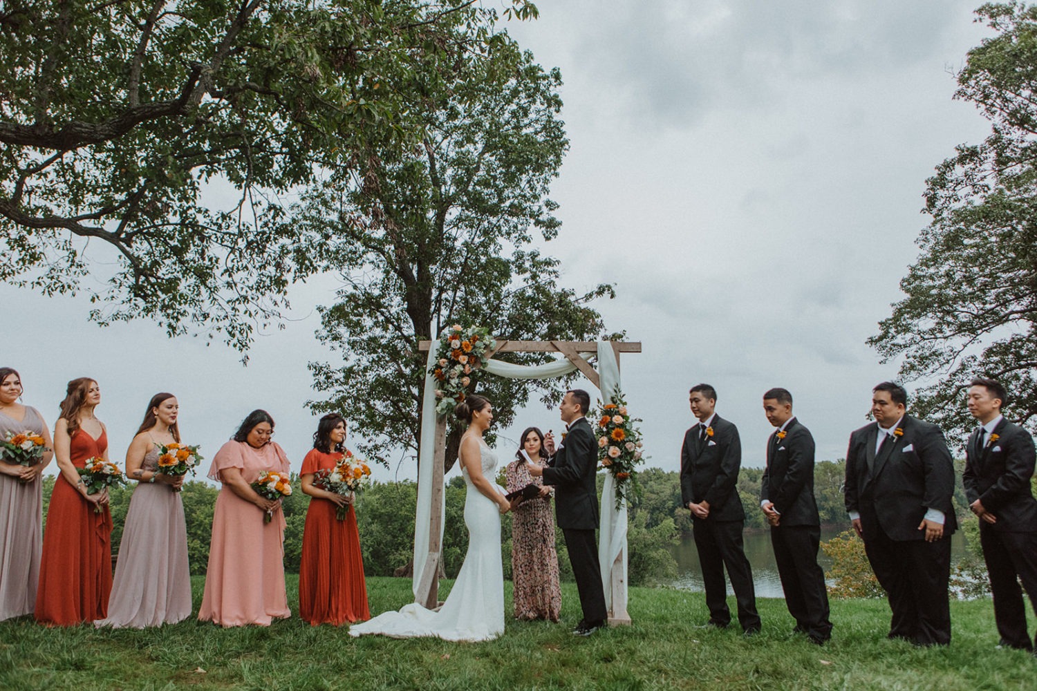 Couple exchanges vows at outdoor wedding