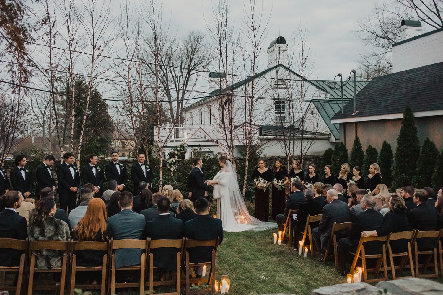 Couple has wedding ceremony in garden at red fox inn wedding