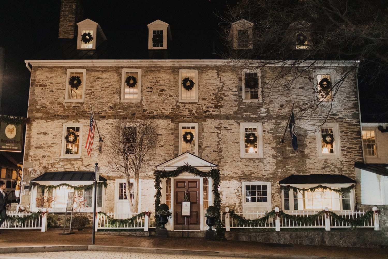 Exterior of red fox inn decorated at Christmas time
