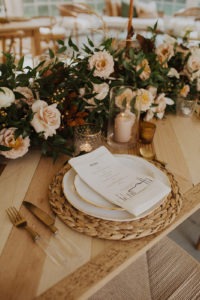 wedding florals with table setting at backyard wedding