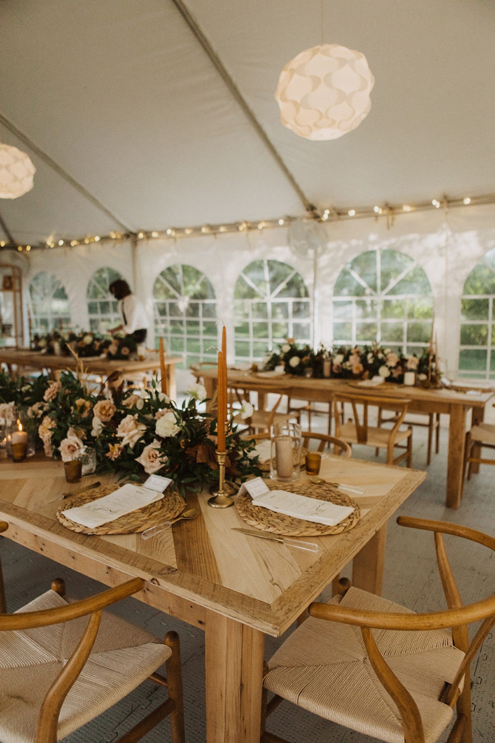 Decorated reception tables at backyard wedding