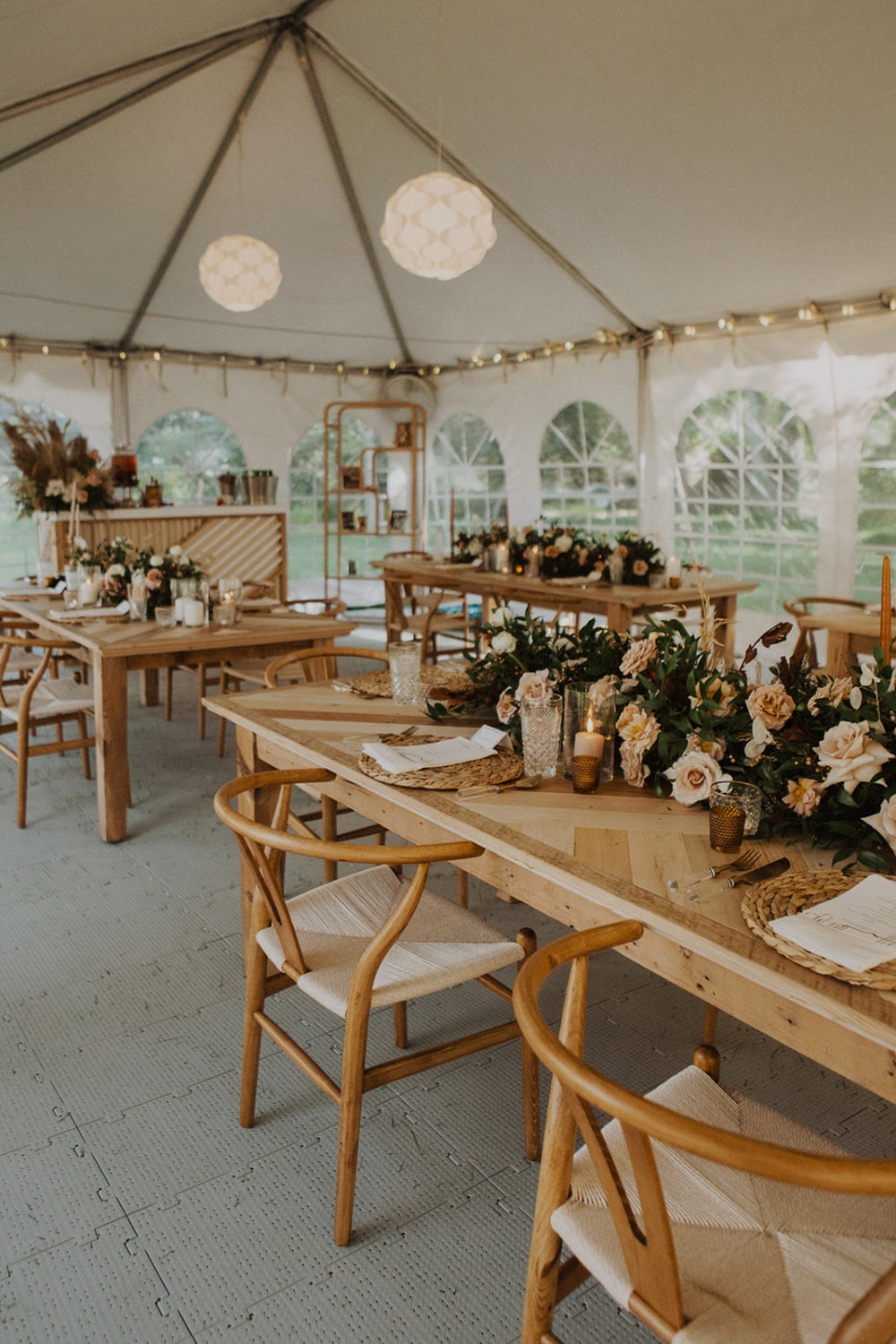 Wedding reception decorated tables in tent