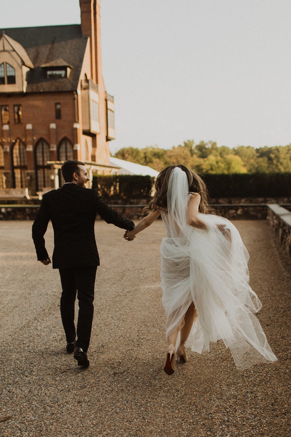 Couple runs across the grounds of Virginia wedding venue