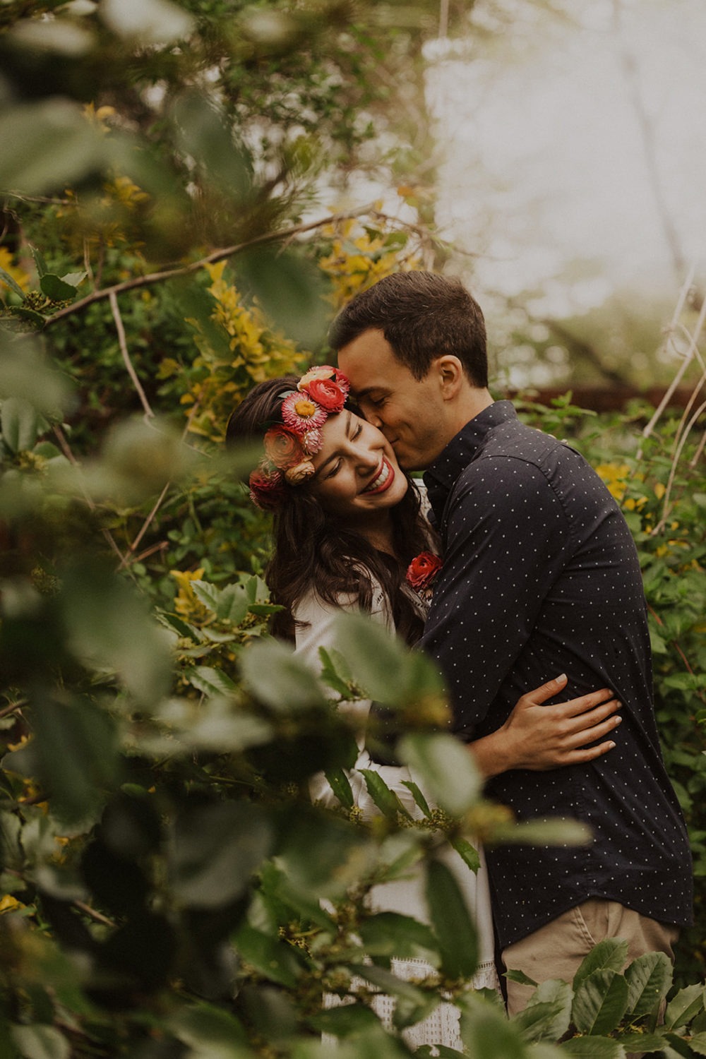 Couple embraces in trees at spring Virginia park elopement