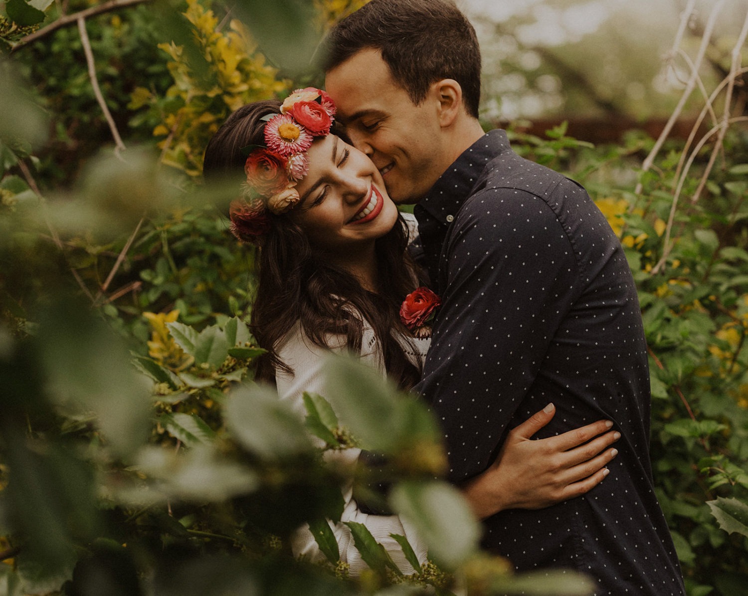 Couple embraces in trees at spring Virginia park elopement