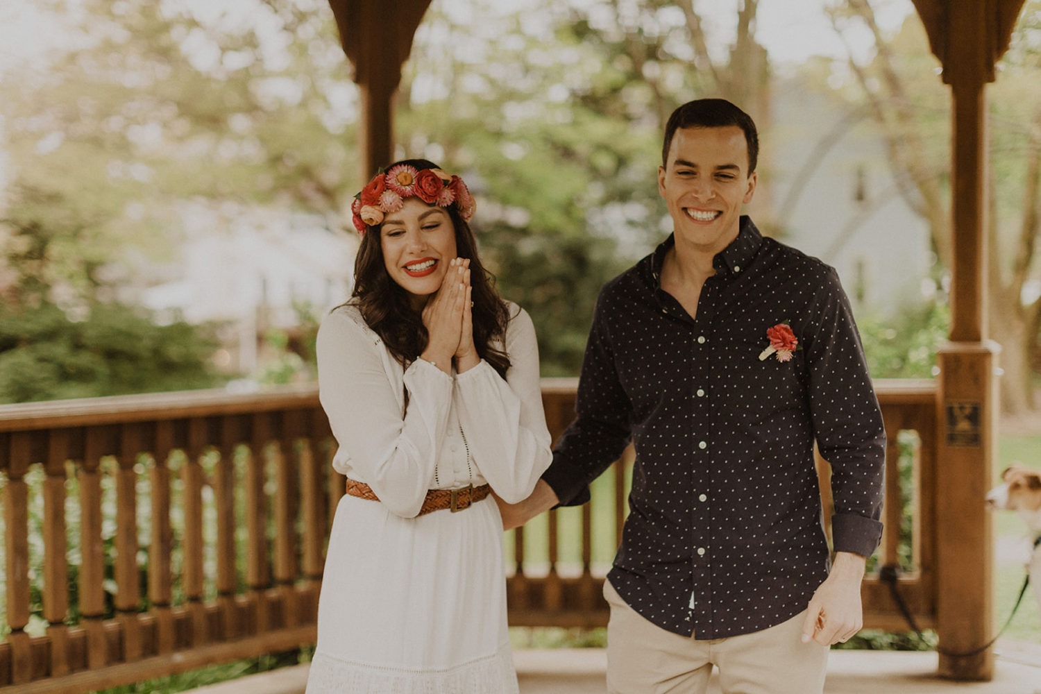 Couple smiles while doing virtual wedding vows