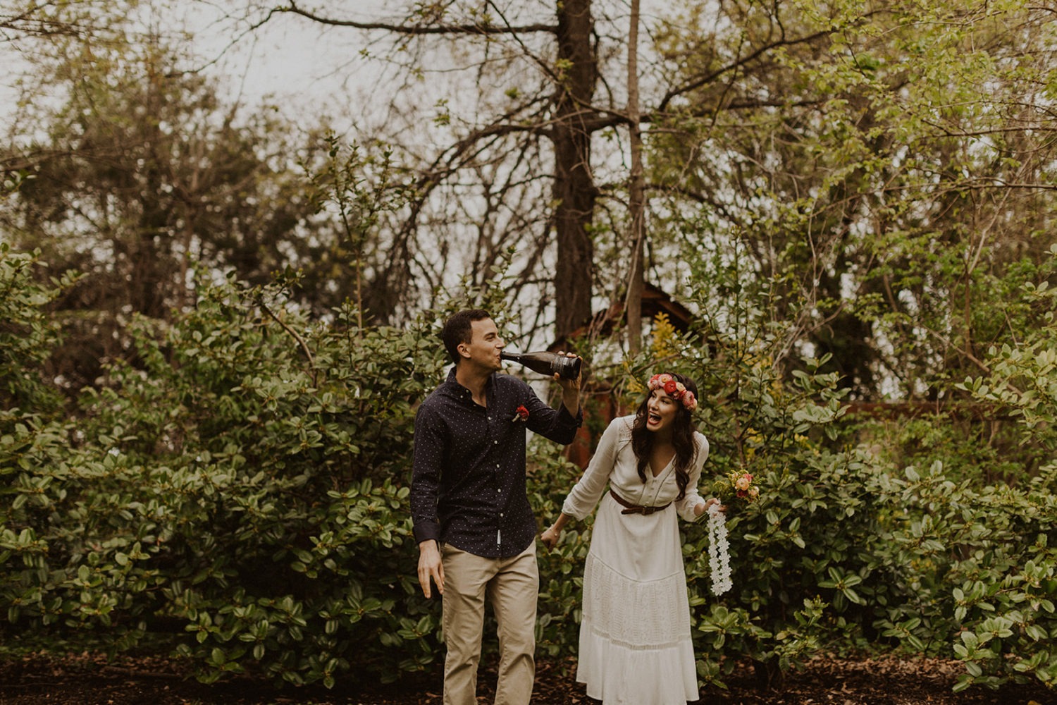 Couple pops champagne at spring Virginia park elopement