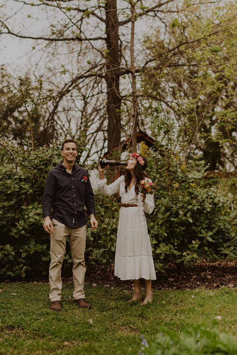 Couple pops champagne at spring Virginia park elopement