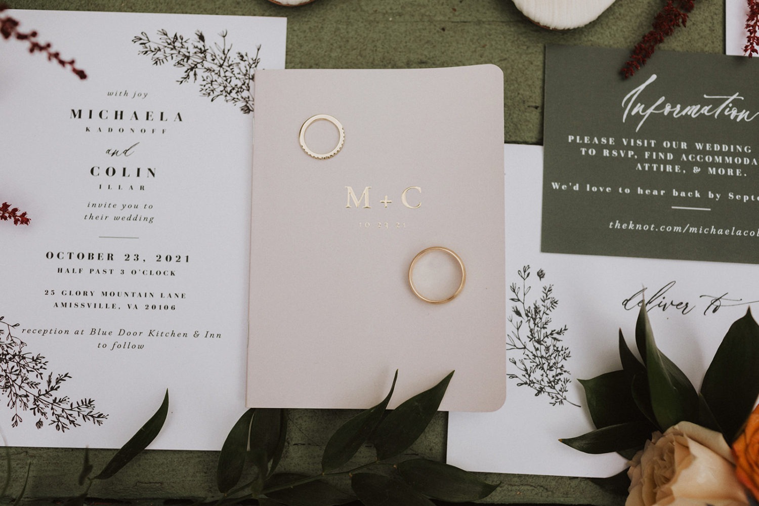 Wedding invitations and wedding rings flat lay