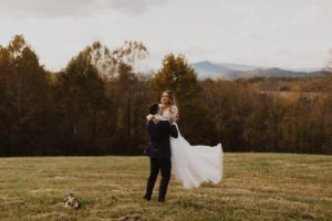 Groom lifts bride at Virginia backyard wedding