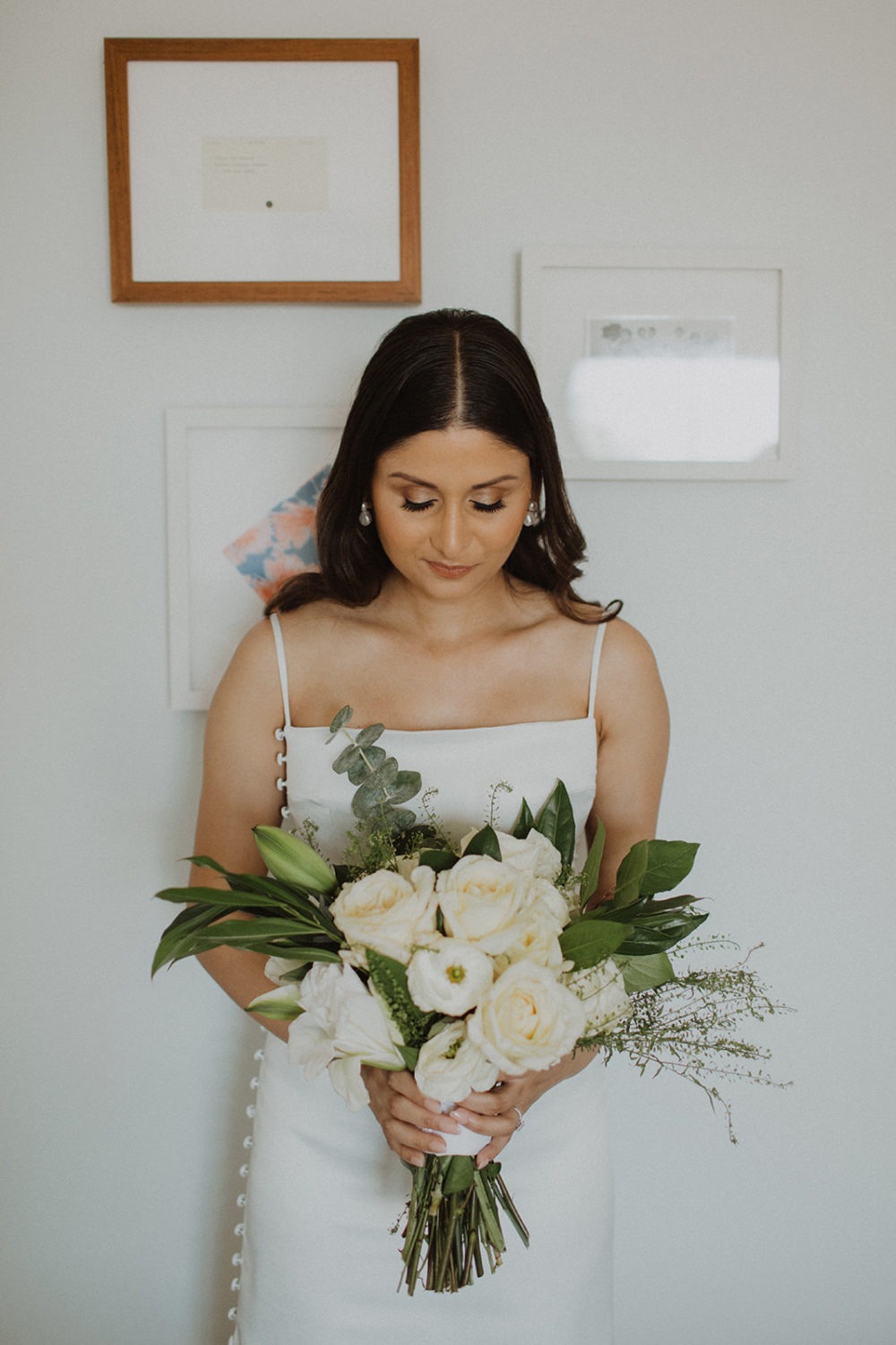Bride holds wedding bouquet at DC rooftop hotel elopement