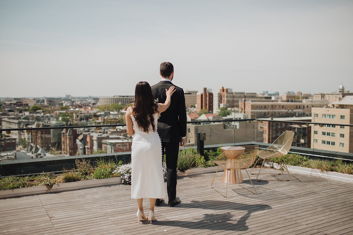 Bride taps groom's shoulder at DC rooftop elopement