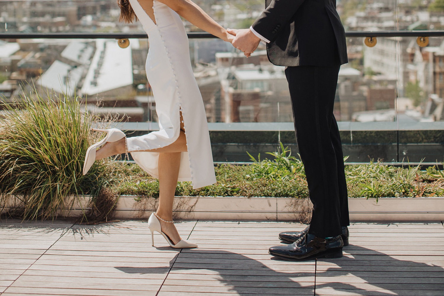 Couple holds hands at DC rooftop elopement