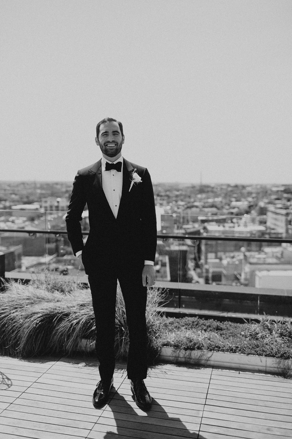 Groomsman stands on roof at DC last-minute elopement