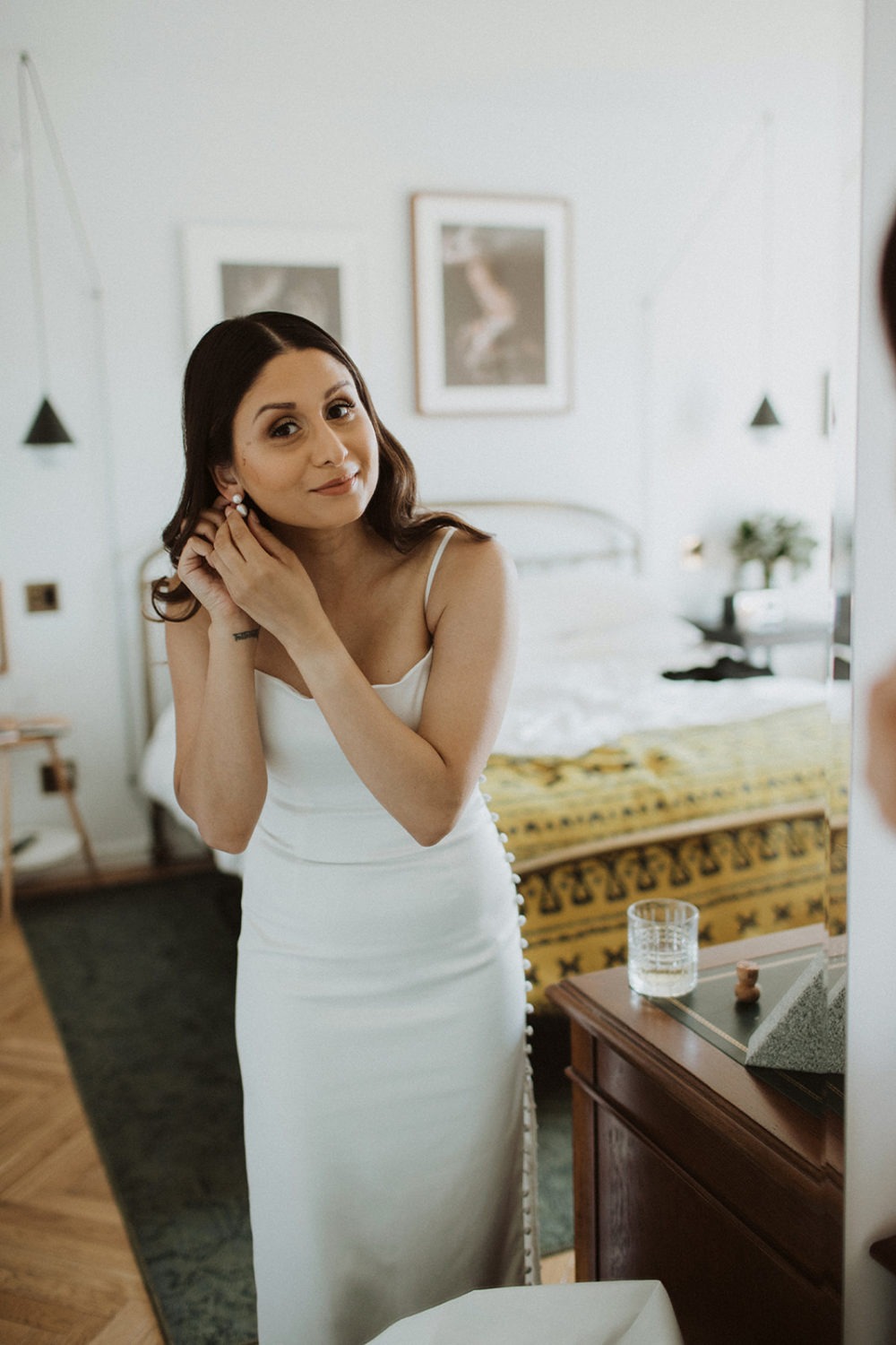 Bride gets ready in hotel room at last-minute elopement