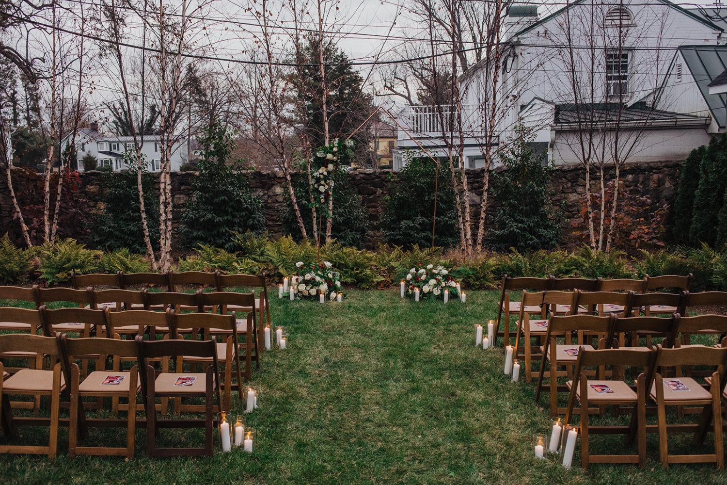 Setup of chairs and wedding florals for wedding ceremony
