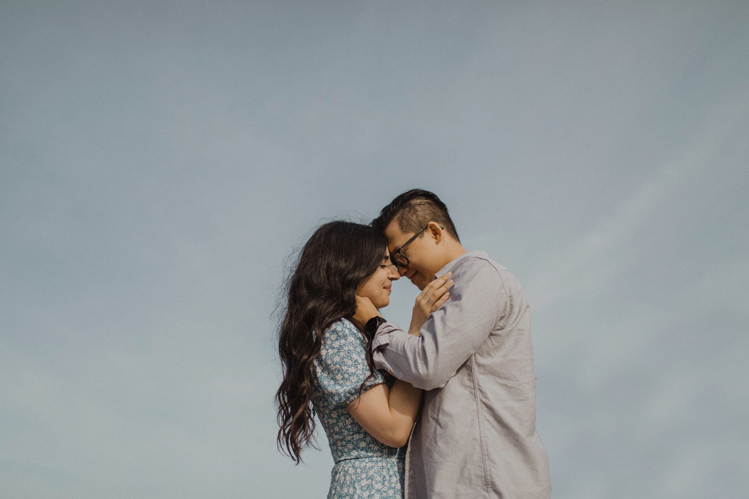 Couple embraces during spring engagement session