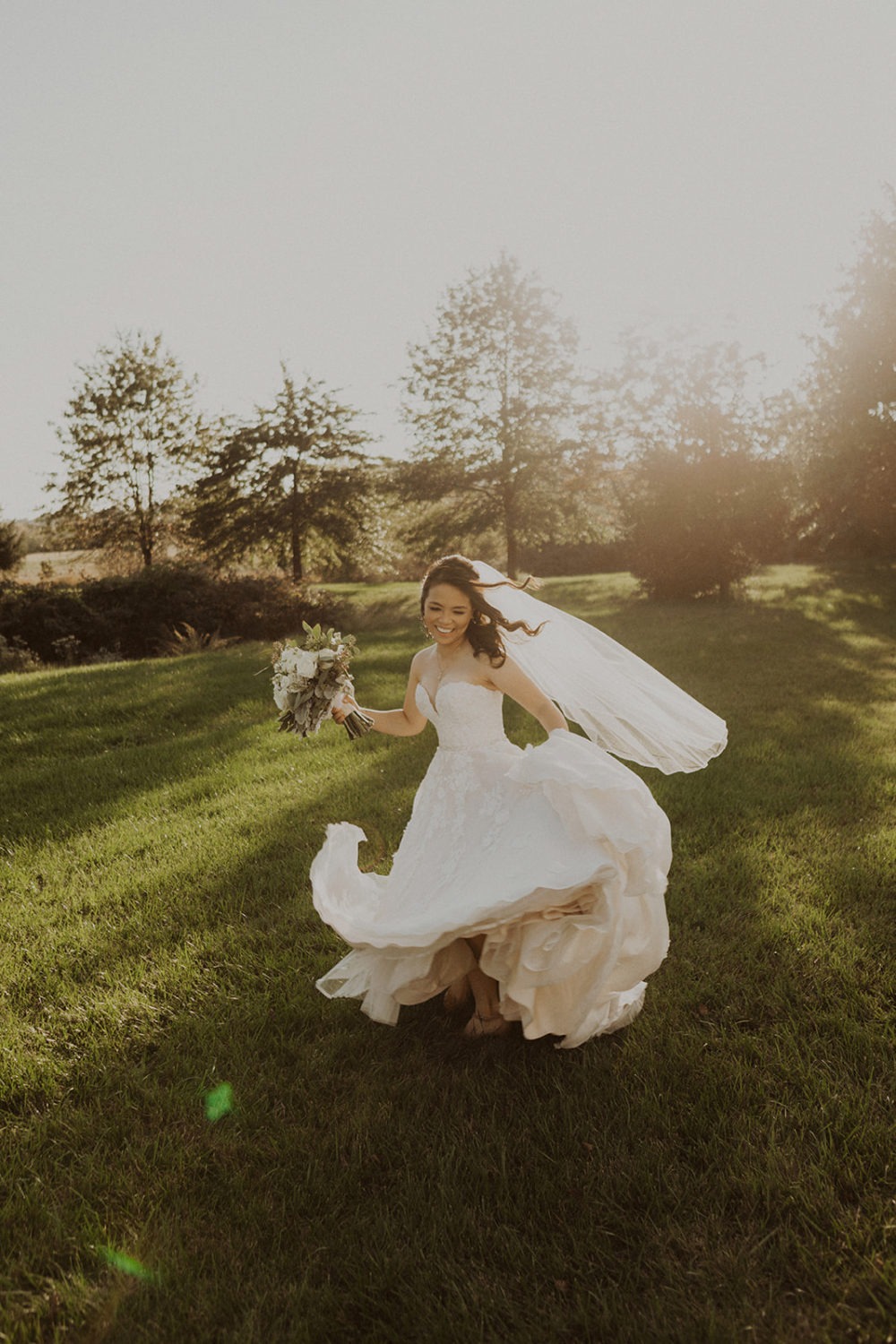 Bride twirls holding wedding bouquet at Virginia wedding venue