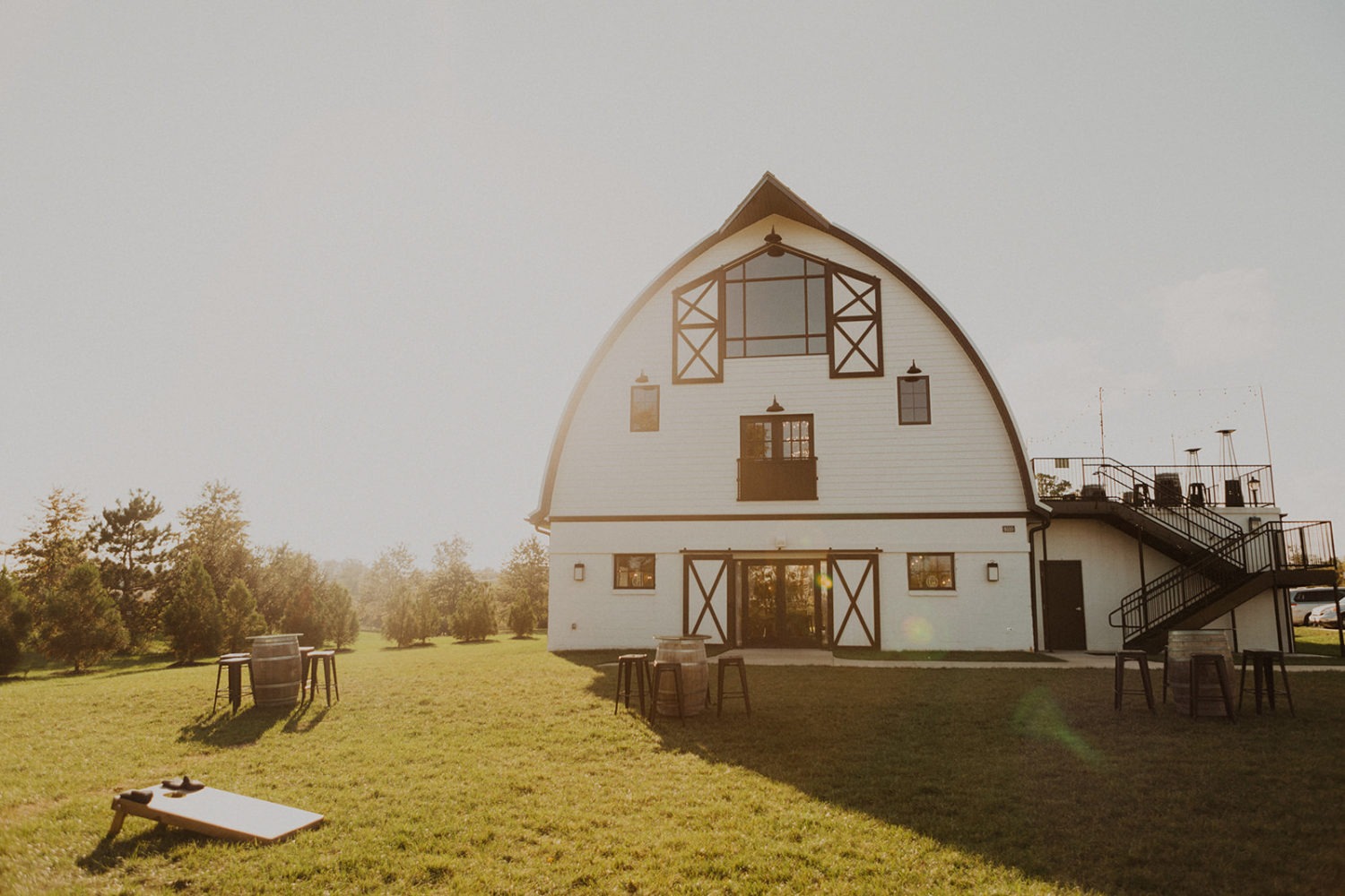 Sunset exterior and lawn of Virginia barn wedding venue