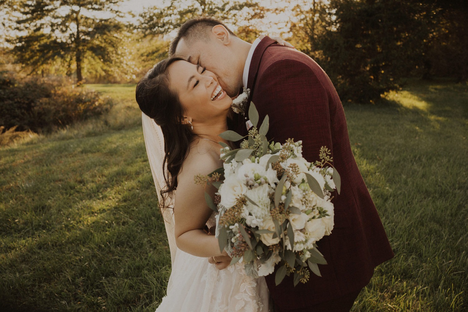 Couple kisses at sunset Virginia wedding venue